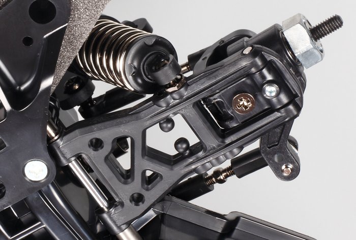 Race-proven reversible suspension arms and CVA oil shocks, complete with soft springs on 3mm-thick FRP mounts