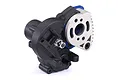An assembled Traxxas RC transmission unit featuring a black plastic housing, a silver metal motor plate, and a blue anodized component.