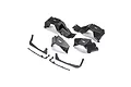 A set of black plastic RC car fender and chassis parts from Axial, arranged on a white background.