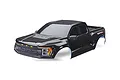 A black Traxxas Ford Raptor R RC truck body shell, pre-painted with detailed grille, headlights, and Raptor R branding, shown against a white background.