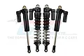 Four GPM Racing black aluminium piggyback shock absorbers for RC cars, shown against a white background with a faint brand logo.