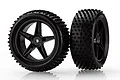 Two black RC buggy wheels with five-spoke rims and knobby off-road tires, shown against a white background.