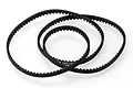 A black Kyosho low friction RC drive belt coiled on a white background.