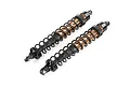 Two Rovan RC front shock absorbers with bronze-coloured bodies and black springs, isolated on a white background.