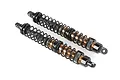 Two Rovan RC rear shock absorbers with black springs and bronze-coloured bodies, shown against a white background.
