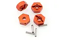 Four orange anodized aluminium 12mm wheel hex adapters and four small metal drive pins for RC cars.