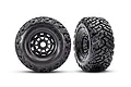 Two Traxxas Maxx SC belted RC tyres mounted on black rims, shown from front and angled views against a white background.