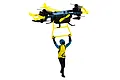 UDI Multi-Fly RC quadcopter drone in black, blue, and yellow, featuring a small action figure hanging from a yellow frame underneath.