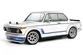A 1/10 scale HPI Sport 3 RC car featuring a white BMW 2002 body with iconic blue and red racing stripes and silver wheels.