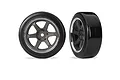 Two RC drift wheels with grey six-spoke rims and smooth black tyres isolated on a white background.