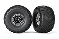 Two Traxxas 2.8 inch Terra Groove monster truck tires mounted on chrome rims against a white background.