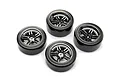 A set of four Traxxas RC drift wheels featuring chrome split-spoke rims and smooth, hard black plastic tyres arranged on a white background.