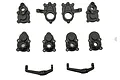A set of black plastic RC portal hub components and steering knuckles arranged on a white background.