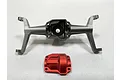A Hobby Plus aluminium front axle housing and a separate red anodised differential cover on a white background.