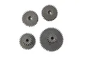 A set of four grey metal transmission gears of varying sizes for an RC vehicle.