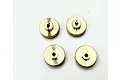 Four circular brass wheel hex adapters for RC cars arranged on a white background.