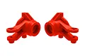 Two bright red Traxxas steering hubs for RC vehicles, shown side-by-side against a white background.