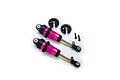 Two pink anodized aluminium Traxxas GTR long shock absorbers with black plastic components and small mounting screws on a white background.