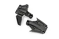Two black plastic Traxxas chassis brace mounts for RC vehicles shown from a top-down perspective on a white background.