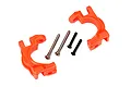 Two bright orange Traxxas heavy duty caster blocks with included metal pins and screws on a white background.