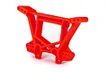 A bright red Traxxas Extreme Heavy Duty rear shock tower for RC vehicles, shown from a three-quarter angle against a white background.