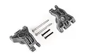 Two grey Traxxas heavy duty rear sub axle carriers with included metal pins and screws on a white background.