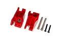 A pair of red Traxxas Extreme Heavy Duty rear stub axle carriers with included metal hinge pins and screws on a white background.