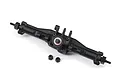 A black Traxxas complete rear axle assembly for an RC car, shown against a white background with two small black nuts placed in front.