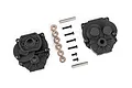 Traxxas front and rear gearbox housing set including black plastic casings, metal screws, washers, and pins on a white background.