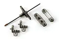 A set of Syma RC helicopter spare parts including a metal inner shaft with a plastic head, two L-shaped blade grips, and two plastic stabilizer bar components.