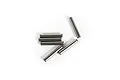 Six small metal drive pins arranged on a white background.