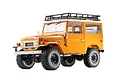 A 1/10 scale FMS Toyota FJ40 Land Cruiser RC rock crawler in yellow, featuring a roof rack, off-road tires, and detailed bodywork against a white background.