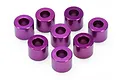 Eight purple anodized aluminum cylindrical spacers arranged on a white background.