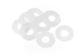 A small pile of eight translucent white plastic cartridge washers on a plain white background.