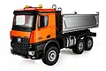 A studio shot of the Huina 1598 RC dump truck in orange, featuring a silver dump bed, black chassis, and off-road tires against a white background.