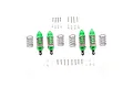 A set of four green aluminium RC shock absorbers with extra springs, screws, and spacers laid out on a white background.