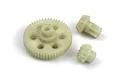 A set of three off-white plastic RC gears including one large spur gear and two smaller pinion-style gears on a white background.