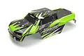 A pre-painted green and black RC truck body shell for the BlackZon Spryte MT, featuring aggressive geometric graphics and branding.