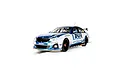 Scalextric 1/32 scale BMW 330E NGTC slot car featuring Laser Tools livery, white and blue paint scheme, and black racing wheels on a track section.