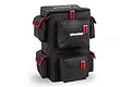 A black Traxxas RC car backpack with multiple storage compartments, red trim, and white Traxxas branding on a white background.
