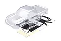 A clear, unpainted Traxxas TRX-4 Sport clipless RC body shell shown with its included decal sheet on a white background.