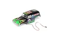 A pre-painted Grave Digger RC truck body shell with green flames, skull graphics, and attached LED headlight wiring on a white background.