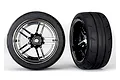 Two Traxxas 1.9-inch Response extra wide rear tyres mounted on black chrome multi-spoke wheels against a white background.