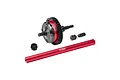 GPM Racing red and black metal RC centre differential set including a main gear assembly, drive shaft, and pinion gear.