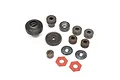 A set of various metal RC transmission gears, washers, and red friction pads arranged on a white background.