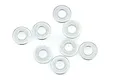 Eight small silver metal washers arranged on a white background.