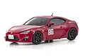 A studio shot of a red Kyosho Mini-Z Toyota 86 RC car with the number 86 on the door, set against a plain white background.