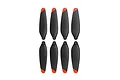 A set of eight black drone propellers with orange tips arranged in two rows of four against a white background.