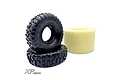 Two black Reefs RC 1.9 inch Scrub tyres with aggressive tread patterns and one yellow foam insert, set against a white background.