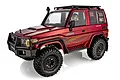 A 1/10 scale RGT Intruder RC rock crawler in metallic red with black off-road accessories, including a roof rack, snorkel, and bull bar.